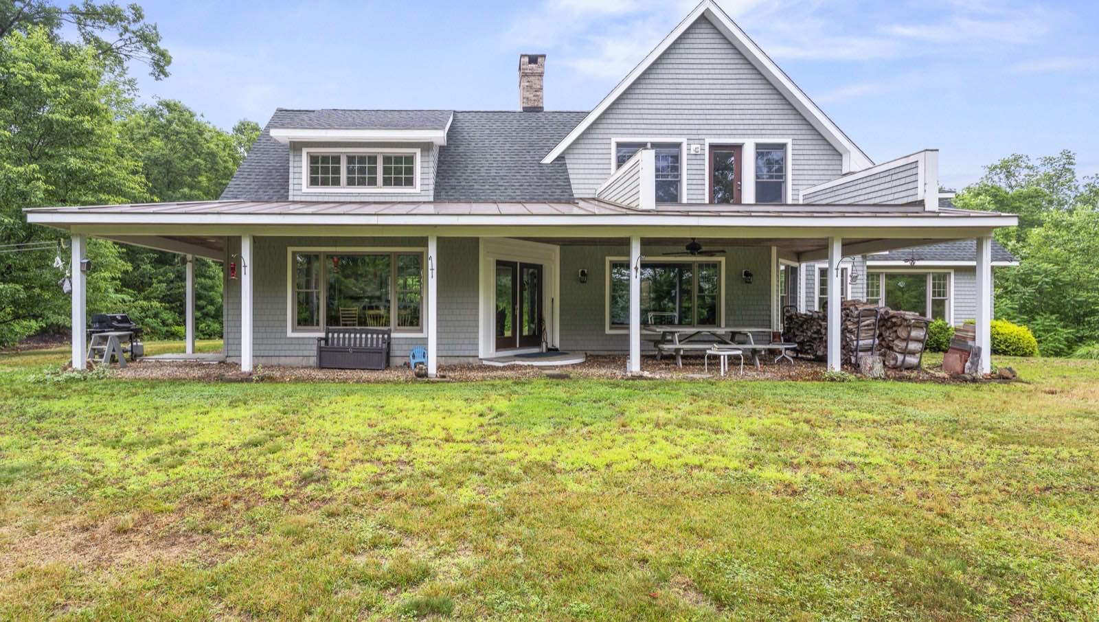 Wraparound farmer's porch on a Connecticut home sold by the Feery Family Team